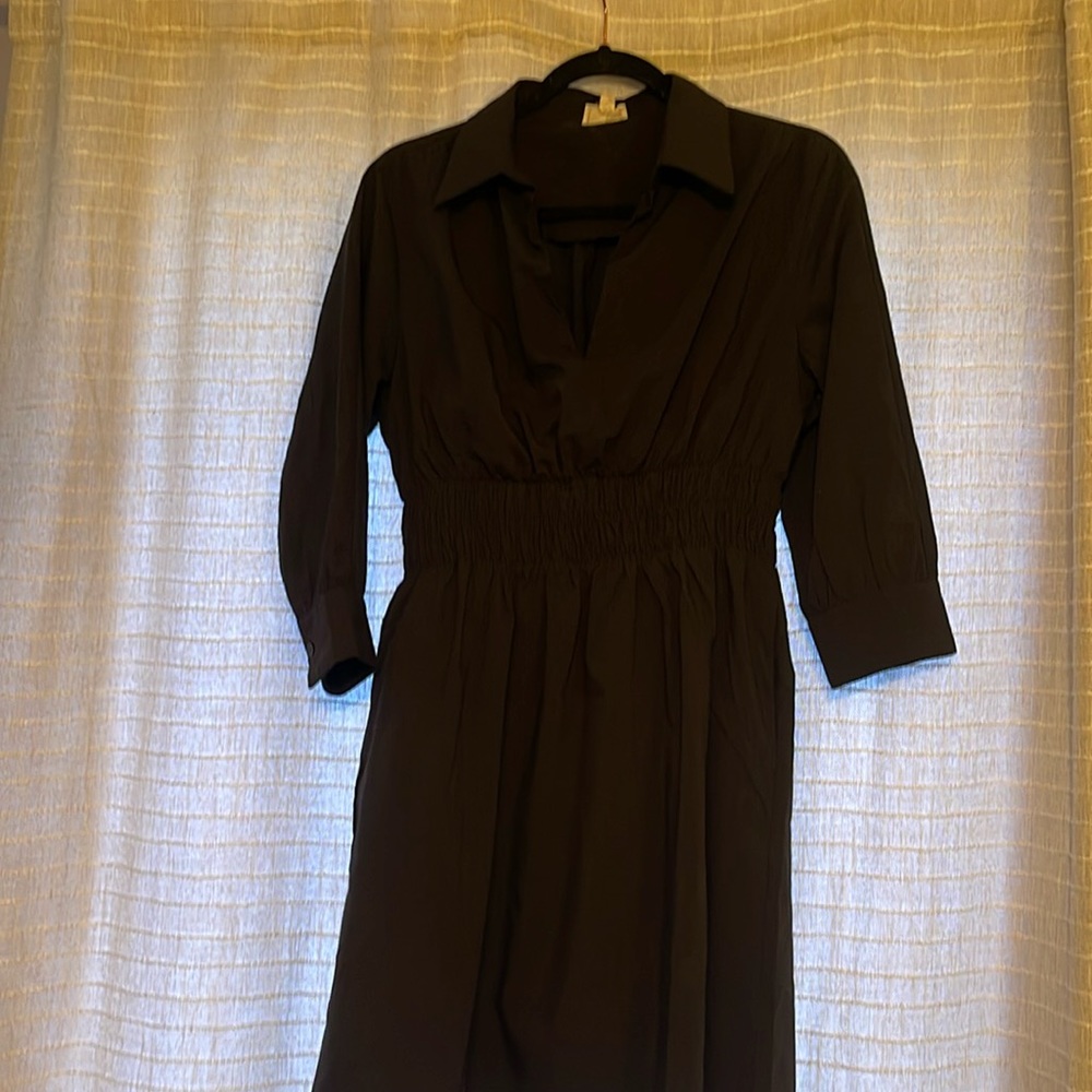Classic black mini dress with quarter length sleeves